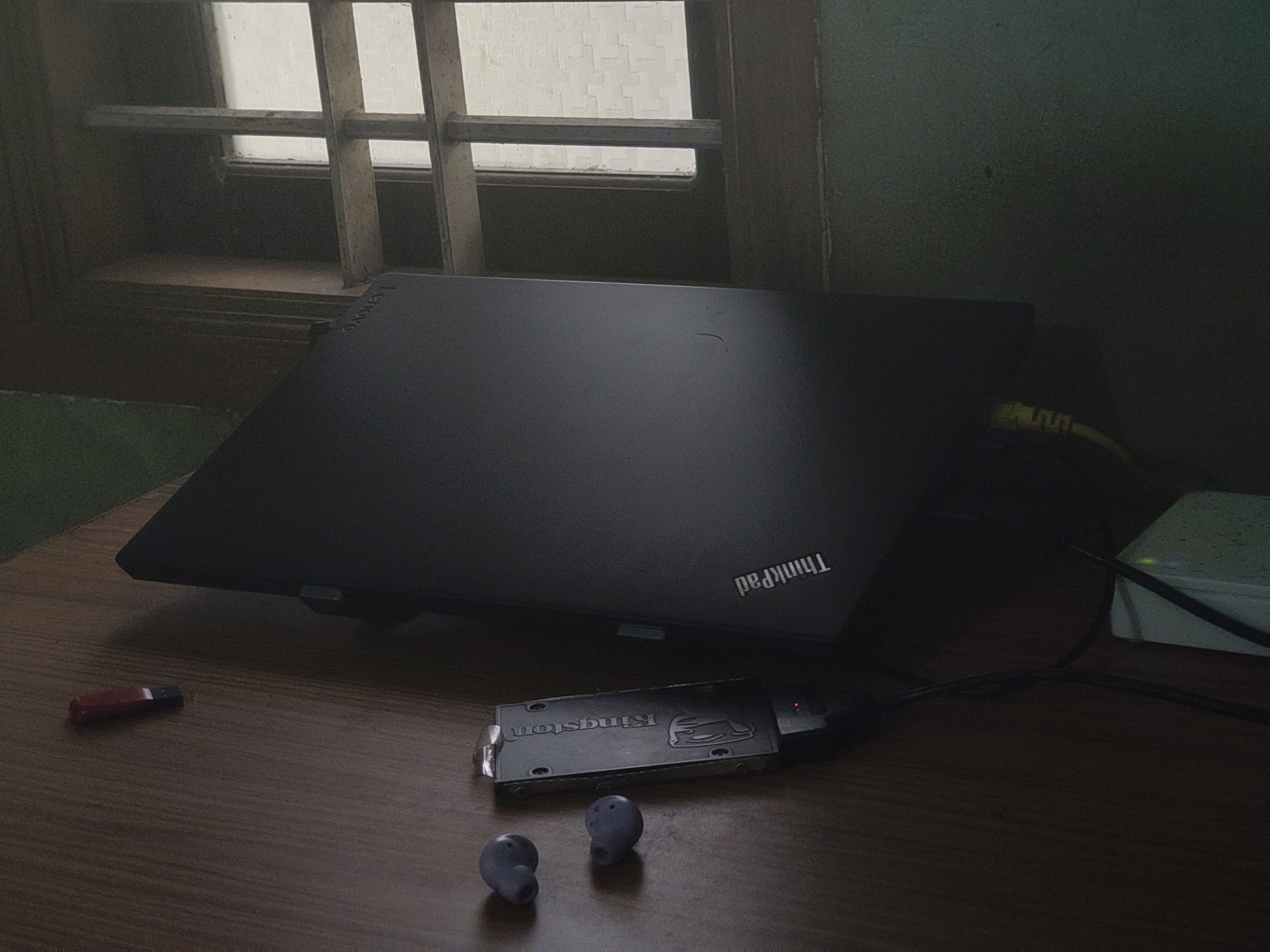Lenovo ThinkPad T480 running Proxmox lab with external SSD